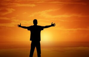 sunset, boy, open arms, nature, gesture, orange sky, silhouette, dusk, man, masculine, pleasure, cheers, happiness, love, lust for life, hug, positive